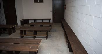 A room with white walls and a black door.